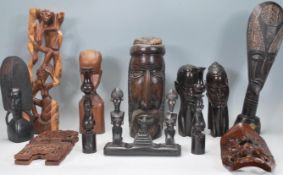 A good mixed collection of 20th Century Tribal African wares to include multiple carved faces of