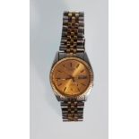 A good gentleman's Seiko 5 Automatic water resistant wrist watch having a gold face with gilt