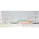 A good group of early 20th Century Art Deco glass cake stands of varying sizes and colours to