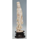 A 19th Century Chinese carved ivory statue / figurine in the form of Guanyin, the Buddhist goddess