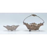 Two 20th Century silver white metal filigree dishes to include one in the form of a basket of