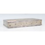 A 20th Century Indian white metal trinket box of rectangular form, the lid engraved with tiger