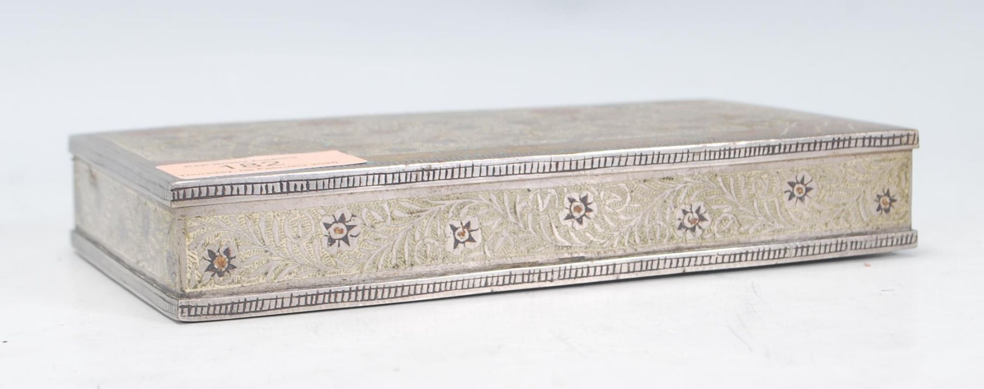 A 20th Century Indian white metal trinket box of rectangular form, the lid engraved with tiger