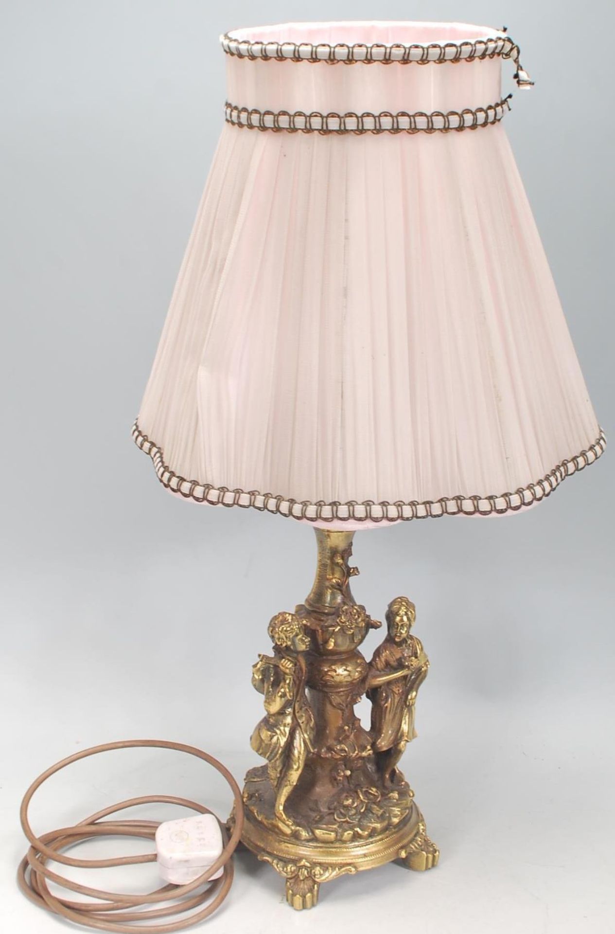 A vintage 20th Century gilt resin table lamp having moulded classical figures with floral moulded