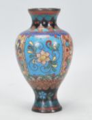 A good 19th Century Chinese cloisonne enamel vases with floral decoration and geometric patterns.