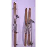 A pair of vintage 1940's Lillywhites ski's of bent