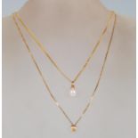 A 9ct gold pendant necklace having a fine flat link chain with a pearl pendant set to a 9ct gold