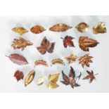 A selection of 20 fashion jewellery brooches each in the form of different leaves having a bronzed