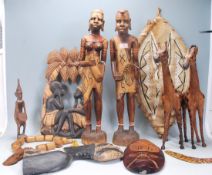 A collection of 20th Century African tribal ware to include a gazelle hide shield, a pair of