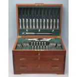 A 20th Century teak wood cutlery canteen with three drawers each having keys being fully appointed