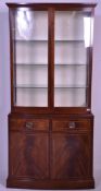 A Regency revival mahogany and line inlaid display cabinet vitrine. Raised on bracket feet with