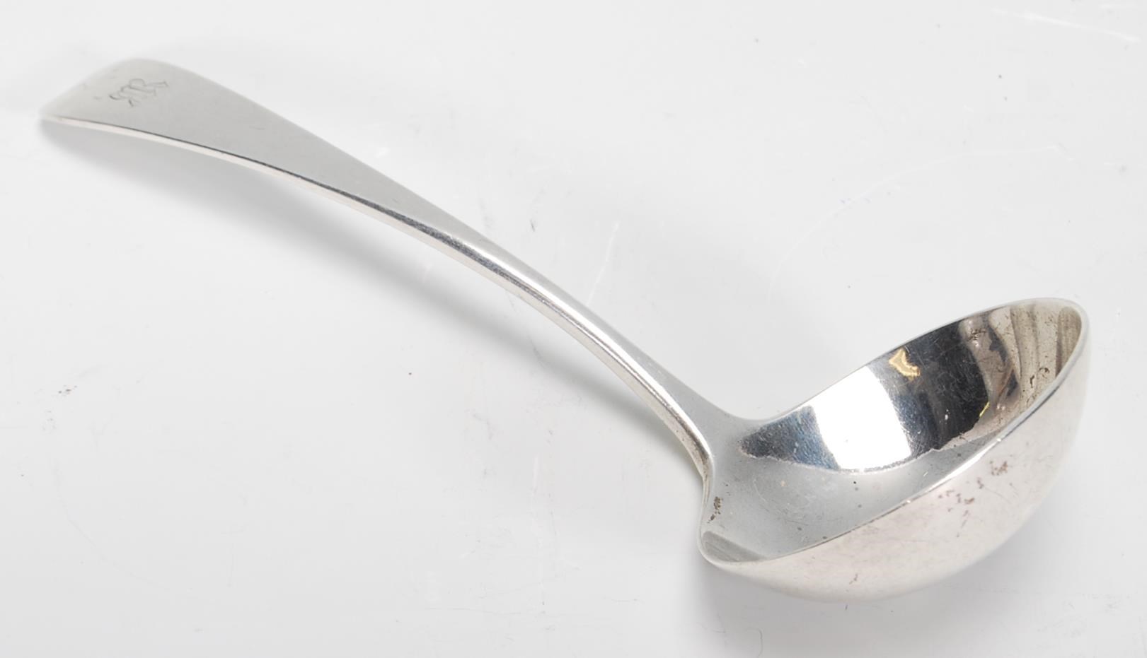 A silver hallmarked serving ladle spoon of usual form, London assay with makers mark for Reid & Sons