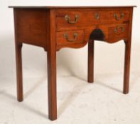A 19th Century Victorian mahogany lowboy - writing table desk. Raised on straight legs supporting