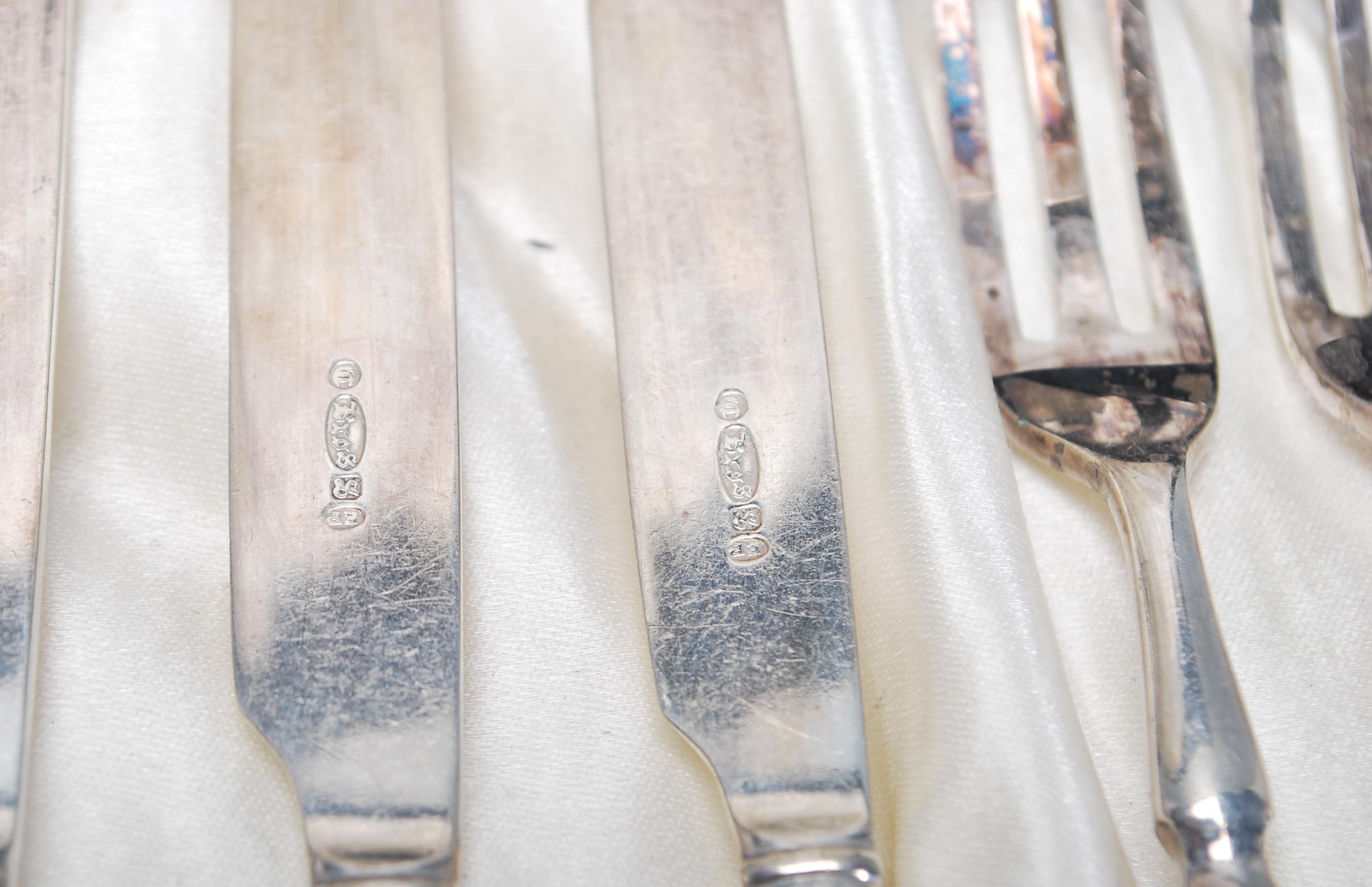 A vintage silver plated cake knife and fork set consisting of six knives and forks set within its - Image 8 of 9