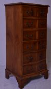 Antique style yew wood pedestal seminaire chest of drawers. Raised on bracket feet with an upright