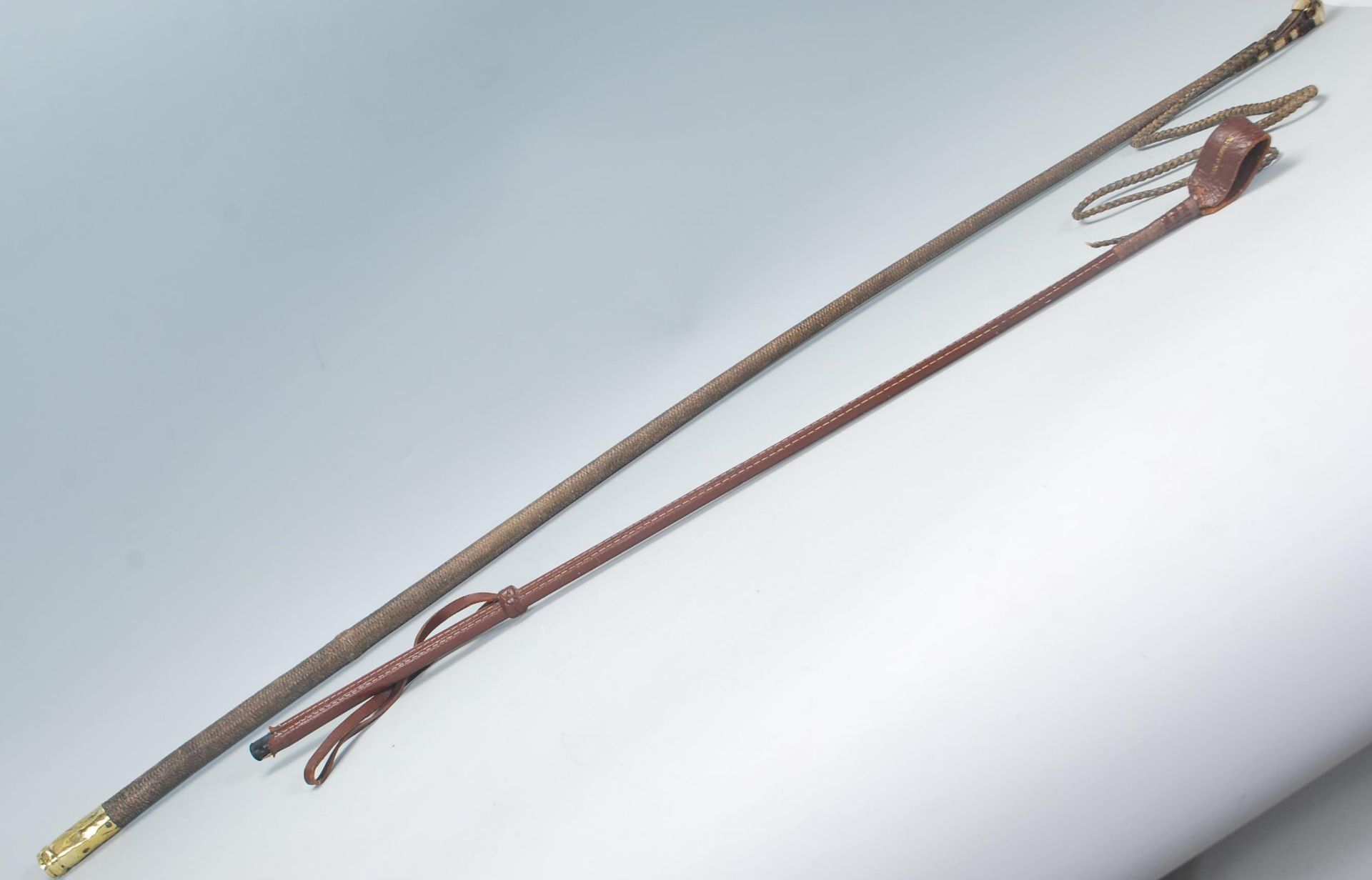 A pair of 20th century horse correction whip, with