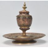 A 19th Century Islamic taste antique copper and brass inkwell having applied copper decoration