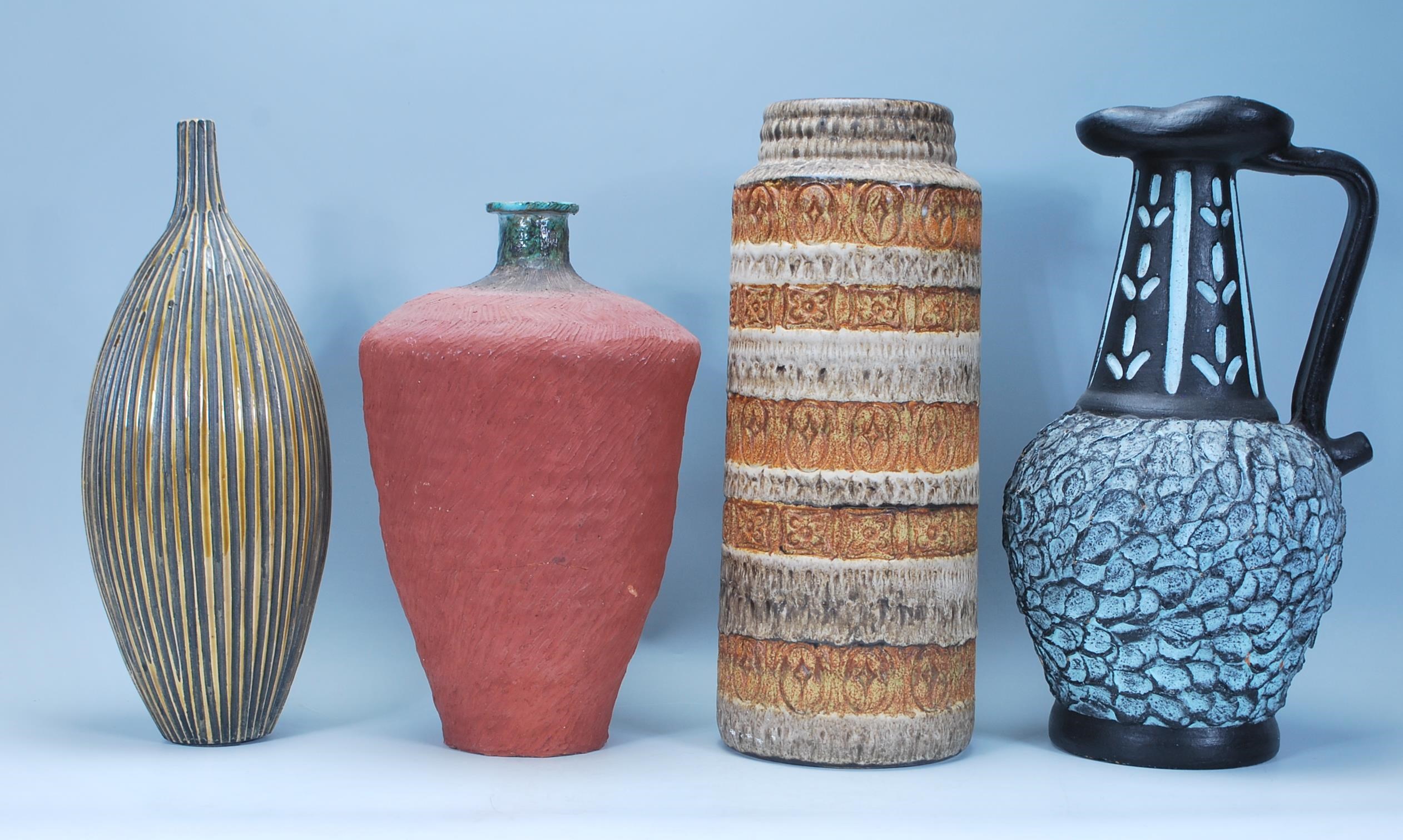 A collection of vintage retro art pottery to include a West German vase having banded decoration,