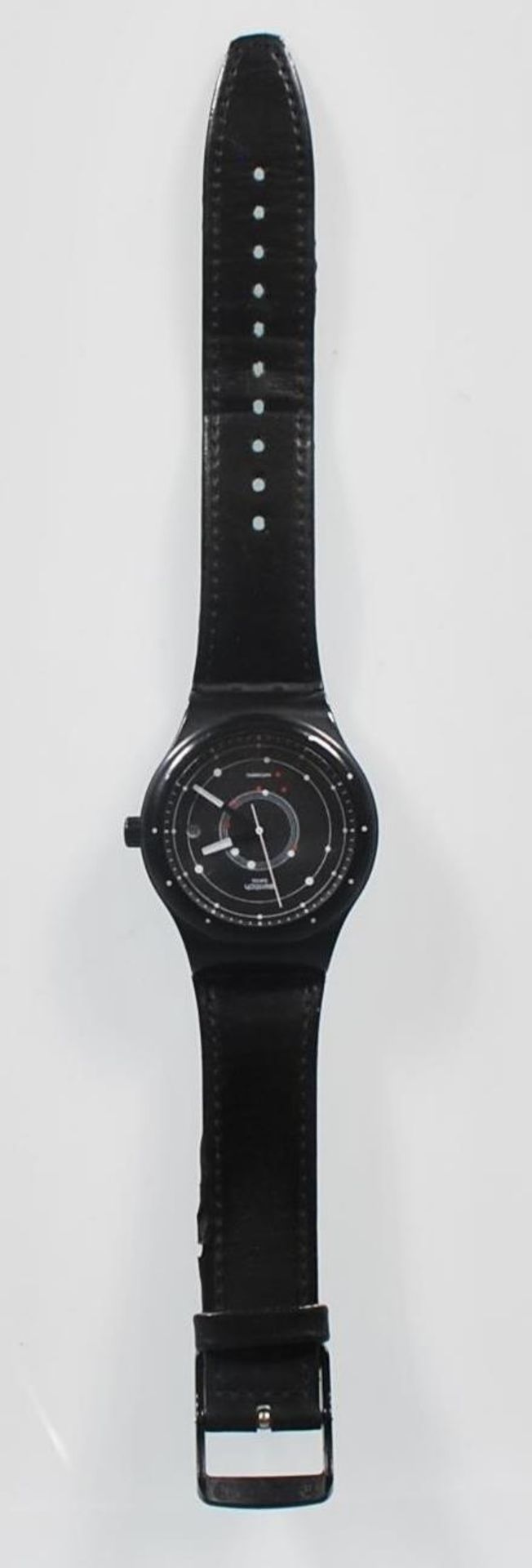 A Swatch Swiss Automatic wrist watch having a black face with a satellite design dial and date