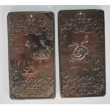 A pair of 20th Century Chinese silver white metal Zodiac ingots cast in relief. One depicting a