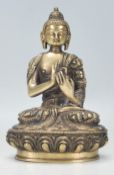 A 20th Century Chinese gilt bronze figure of Buddha draped in garments seated in the lotus