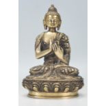 A 20th Century Chinese gilt bronze figure of Buddha draped in garments seated in the lotus