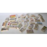 A collection of vintage cigarette and tea trade cards in mostly complete bundles. Sets include Wills