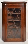 A 19th Century Victorian antique mahogany corner cabinet having chamfered edges with reeded frieze