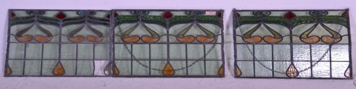 A set of three turn of the Century Art Nouveau lead lined stained glass windows having floral type