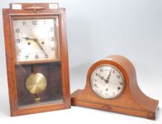 An early 20th century dome top mantel clock with silvered dial and inset brass Westminster chime