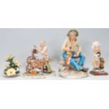 A group of three 20th Century Capodimonte figurines to include a Giacomo Leatti knife sharpener