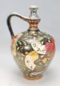An early 20th Century Hungarian Arts and Crafts jug of tapering bulbous form having a curved