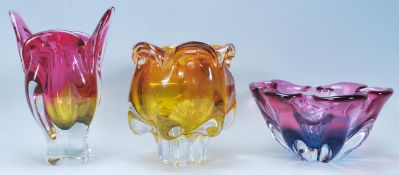 A group of three Czechoslovakian vintage retro pieces of studio art glass to include a pink and blue