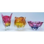 A group of three Czechoslovakian vintage retro pieces of studio art glass to include a pink and blue