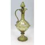 A 20th Century Murano green glass ewer jug having a reeded bulbous form body with a twisted neck,