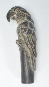 A 20th century bronze / brass walking stick top / handle in the form of a perching parrot with