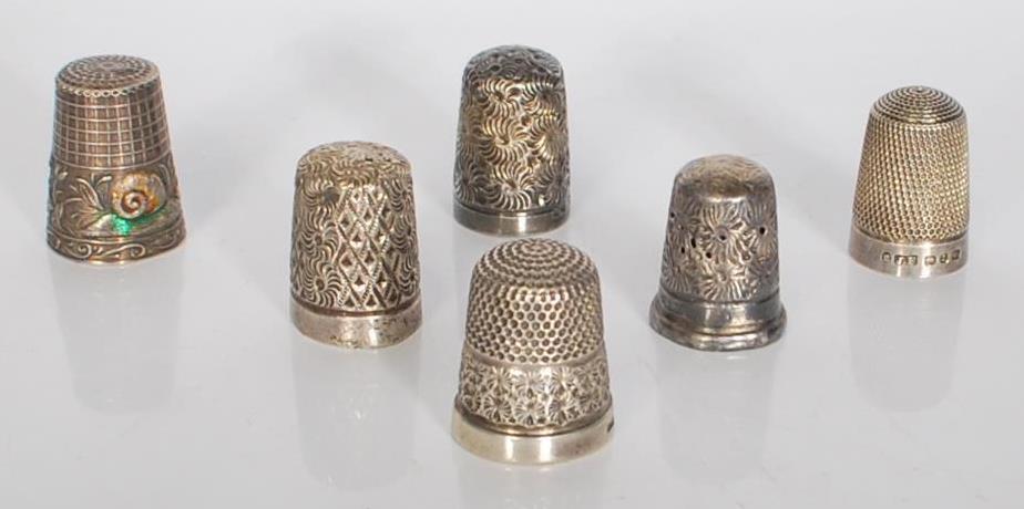 A selection of silver thimbles dating from the 19th Century onwards, five being English hallmarked