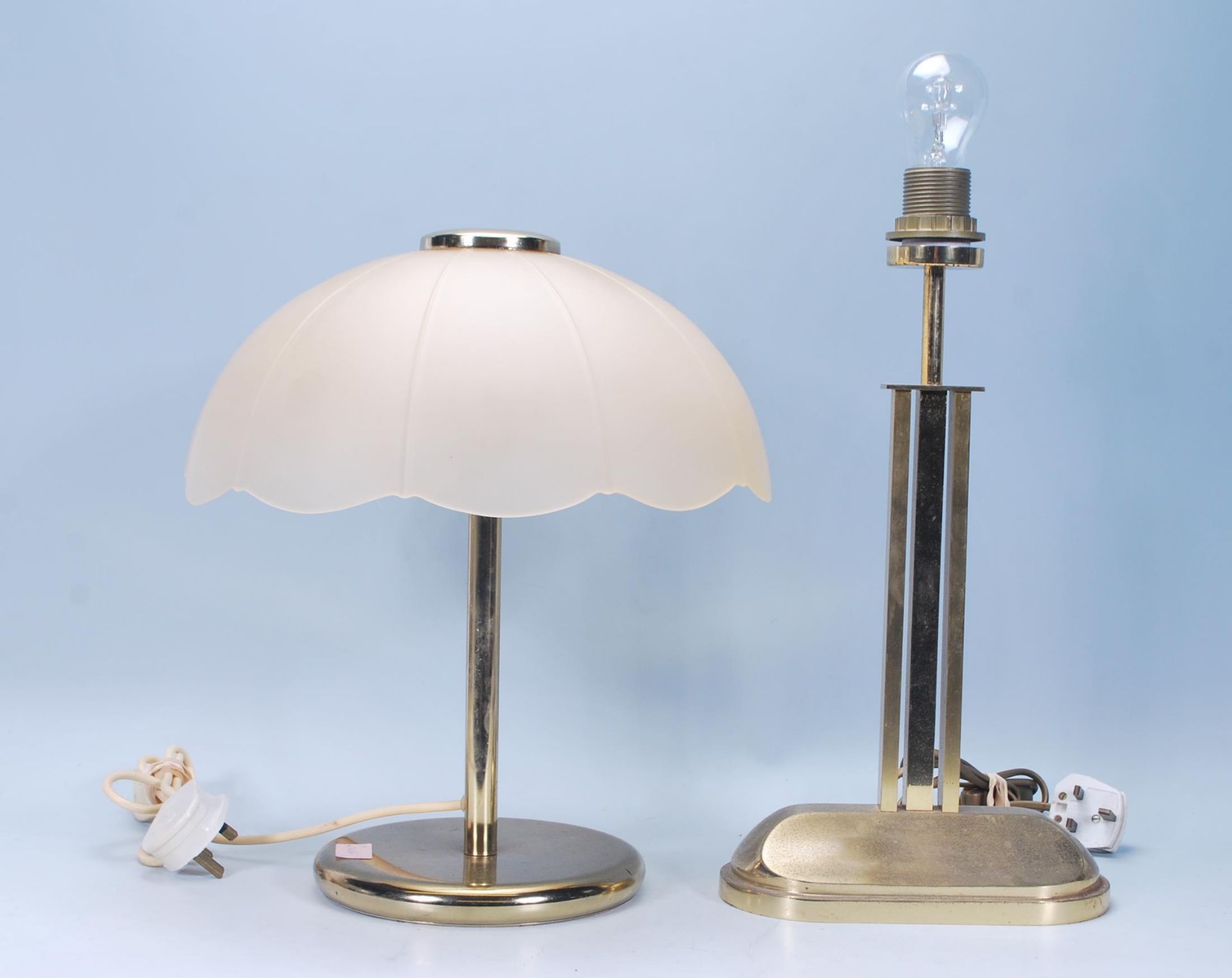 Two vintage retro 20th Century brass table lamps. One in the Art Deco style having a straight