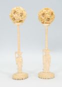 A matching pair of 19th Century Chinese ivory puzzle balls. The outer layer of the ball carved