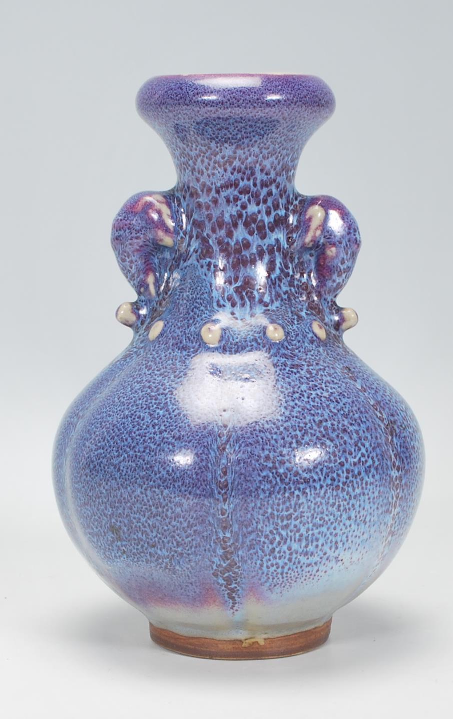 A Chinese earthenware / Jun ware style vase having a bulbous body with tapering neck and twin - Image 3 of 6