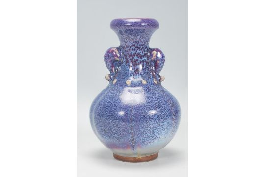 A Chinese earthenware / Jun ware style vase having a bulbous body with tapering neck and twin - Image 3 of 6