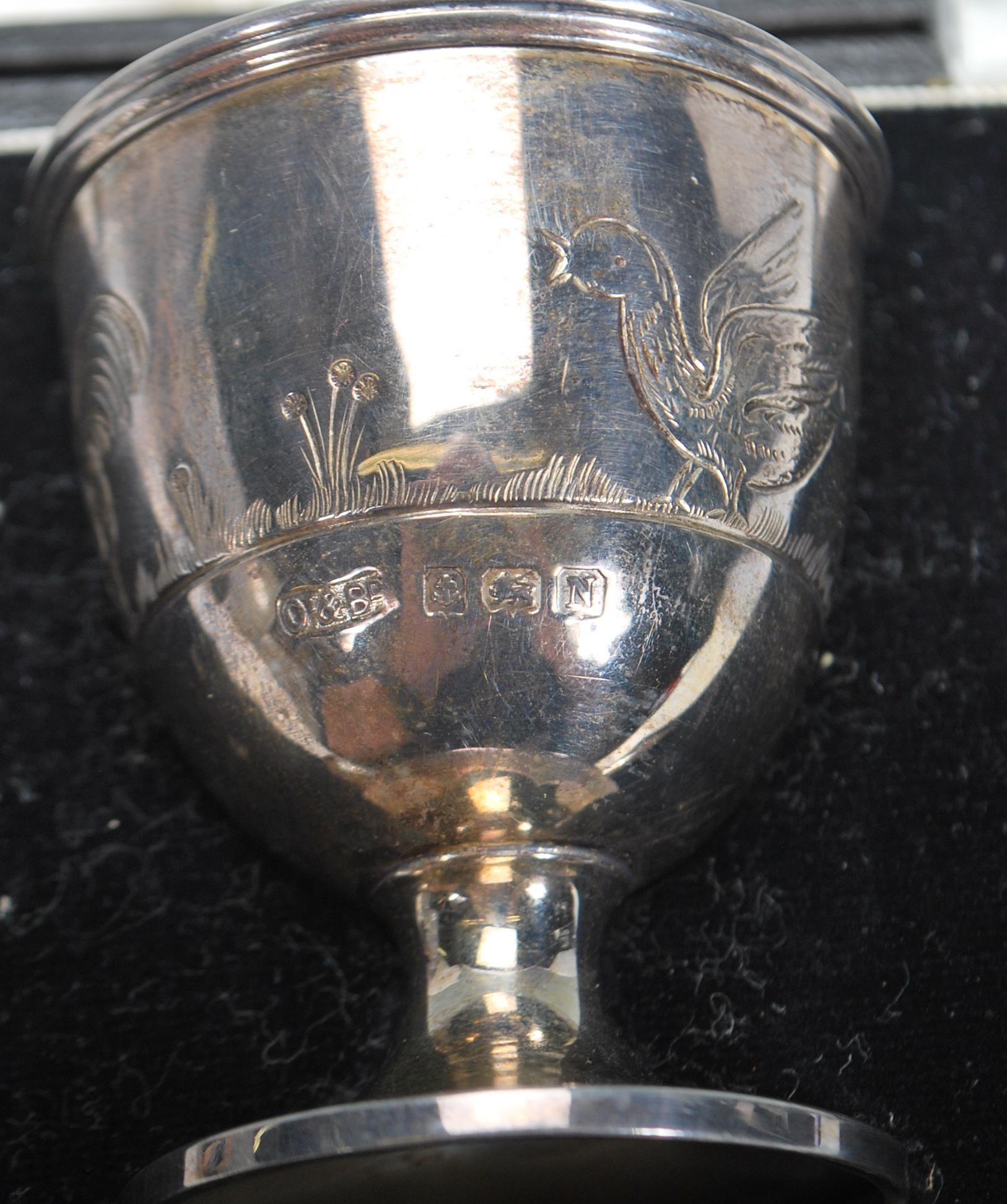 A silver hallmarked engraved child's egg cup and spoon christening set, the spoon and cup each chase - Image 5 of 8