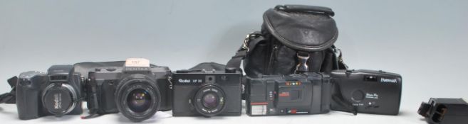 A collection of vintage film cameras to include a Pentax P30 with a Sigma UC zoom 28-70mm lens, a