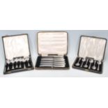 Two boxed sets of six silver hallmarked tea spoons to include a set of R W Hewett & Co spoons having