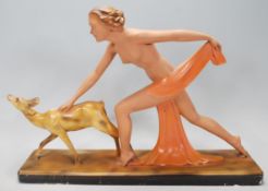 An early 20th century 1920's / 1930's art deco chalkware sculpture depicting a nude female figure