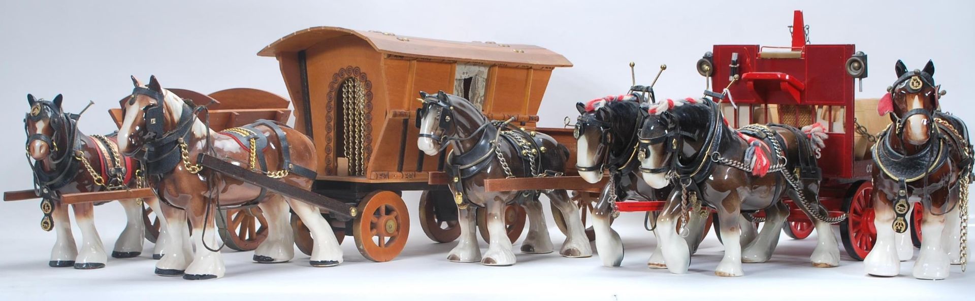 A mixed collection of vintage 20th Century horses and wagons / stagecoaches in the manner of Beswick