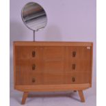 A vintage retro 20th Century light oak dressing table / chest of drawers having a single stem