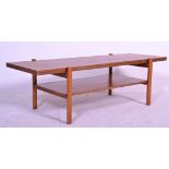 A retro 20th Century teak wood coffee table, flared top raised on turned supports united by under-