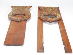 An early 20th Century mahogany book slide having shaped folding bookends to each side having pierced