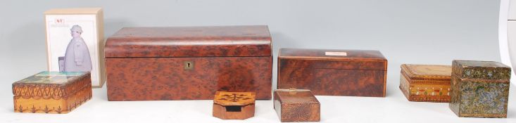 A collection of antique and vintage boxes to include a walnut music box of rectangular form,